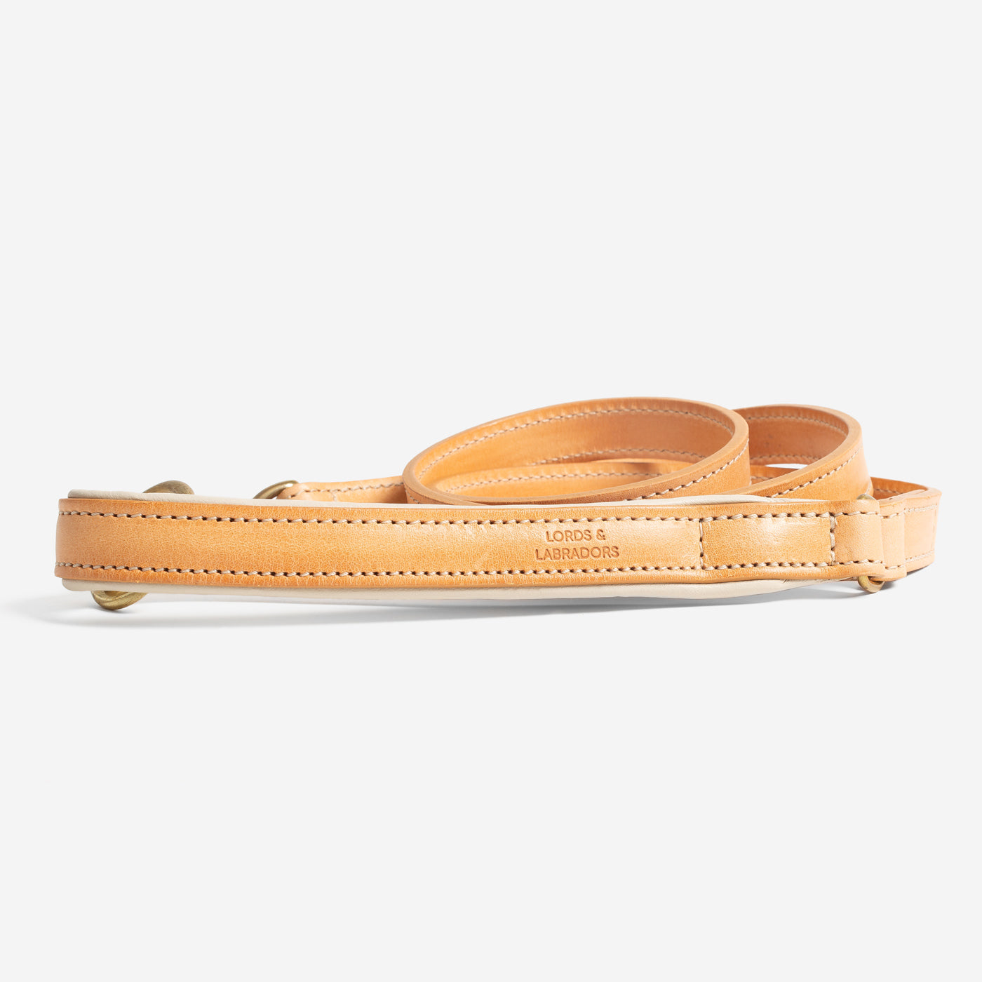 Discover dog walking luxury with our handcrafted Italian padded leather dog Leash in Tan & Cream! The perfect Leash for dogs available now at Lords & Labradors US