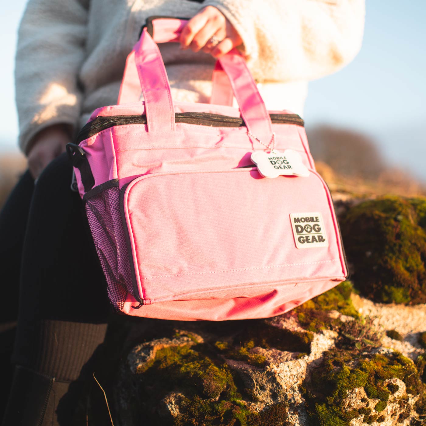 Discover, Mobile Dog Gear Week Away Bag, in Pink. The Perfect Away Bag for any Pet Parent, Featuring dividers to stack food and built in waste bag dispenser. Also Included feeding set, collapsible silicone bowls and placemat! The Perfect Gift For travel, meets airline requirements. Available Now at Lords & Labradors US