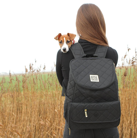 Discover, Mobile Dog Gear Weekender Backpack, in Black. The Perfect Away Bag for any Pet Parent, Featuring dividers to stack food and built in waste bag dispenser. Also Included feeding set, collapsible silicone bowls and placemat! The Perfect Gift For travel, meets airline requirements. Available Now at Lords & Labradors US