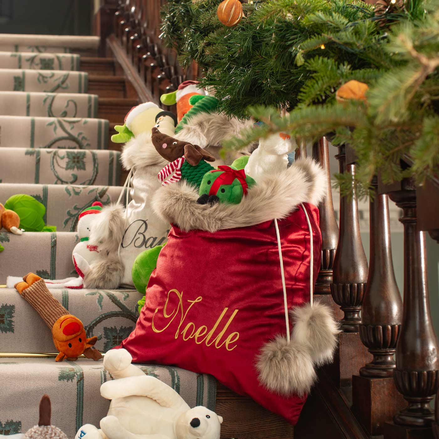 Discover our Christmas Santa Sack in Cranberry Velvet featuring drawstring tightening. The perfect Luxury pet gift for your Dog, Cat, Family and Fiends, now available to Personalize at Lords & Labradors US