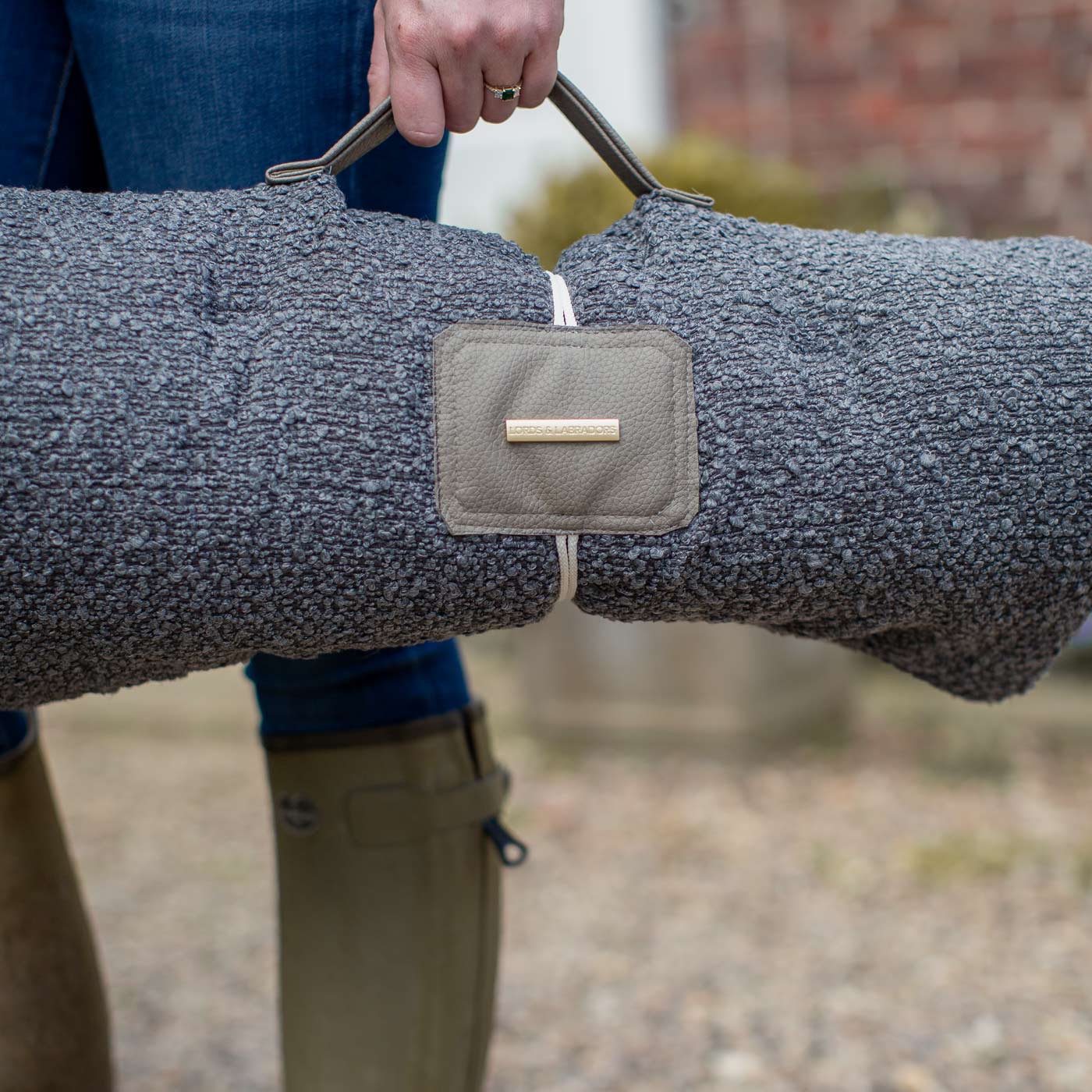 Embark on the perfect pet travel with our luxury Travel Mat in Granite Boucle. Featuring a Carry handle for on the move once Rolled up for easy storage, can be used as a seat cover, boot mat or travel bed! Available now at Lords & Labradors US