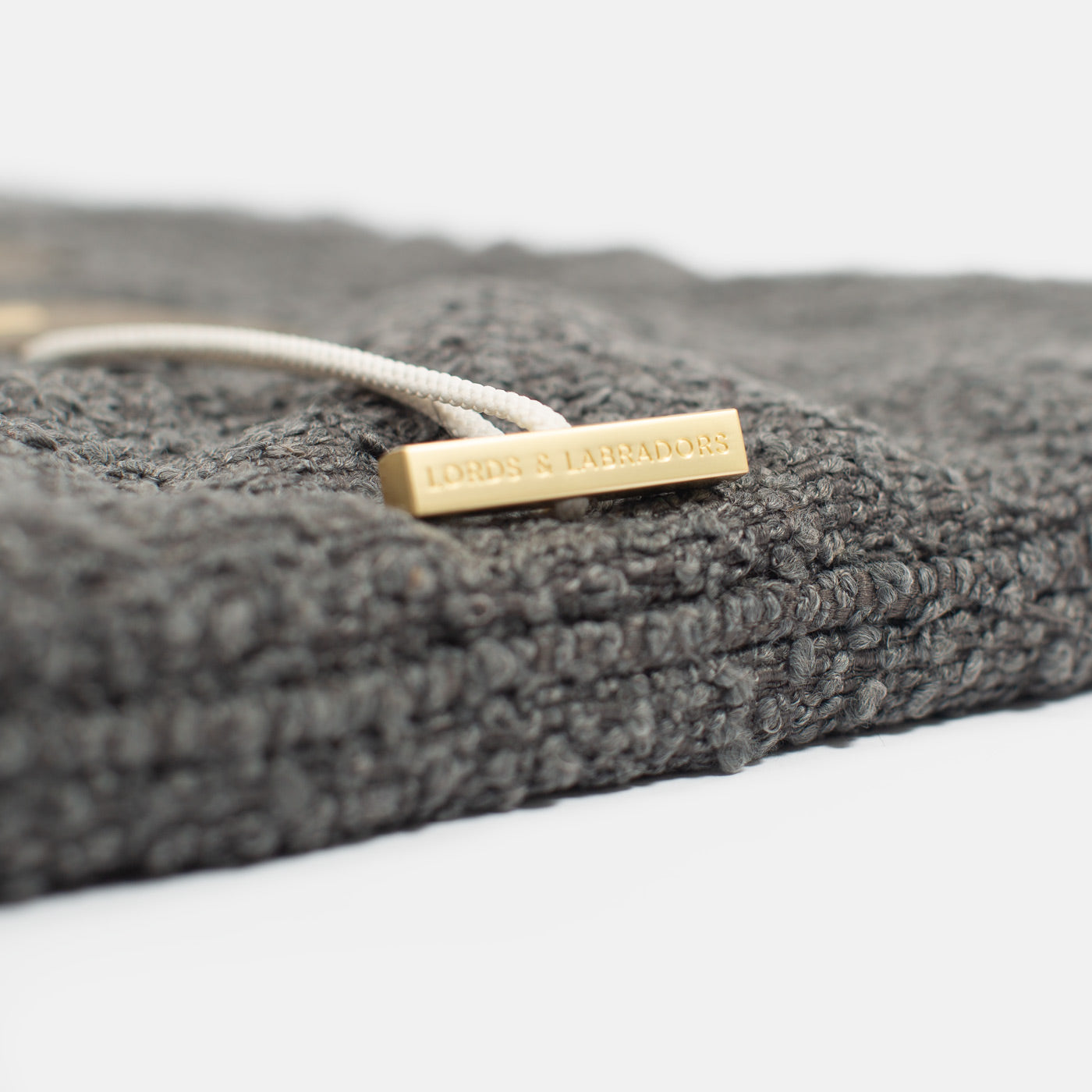 Embark on the perfect pet travel with our luxury Travel Mat in Granite Boucle. Featuring a Carry handle for on the move once Rolled up for easy storage, can be used as a seat cover, boot mat or travel bed! Available now at Lords & Labradors US