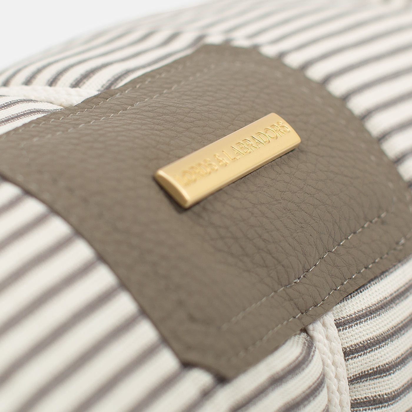 Embark on the perfect pet travel with our luxury Travel Mat in Regency Stripe. Featuring a Carry handle for on the move once Rolled up for easy storage, can be used as a seat cover, boot mat or travel bed! Available now at Lords & Labradors US