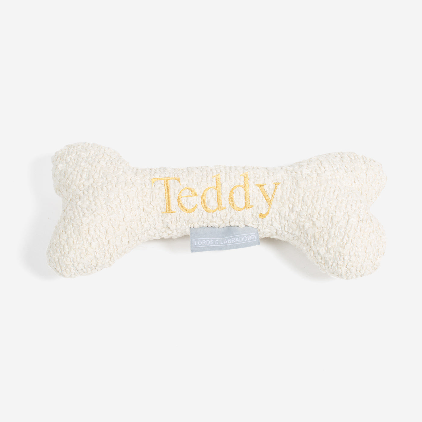 Present The Perfect Pet Playtime With Our Luxury Dog Bone Toy, In Stunning Ivory Bouclé! Available To Personalize Now at Lords & Labradors US, Shop Luxury Dog Toys Online