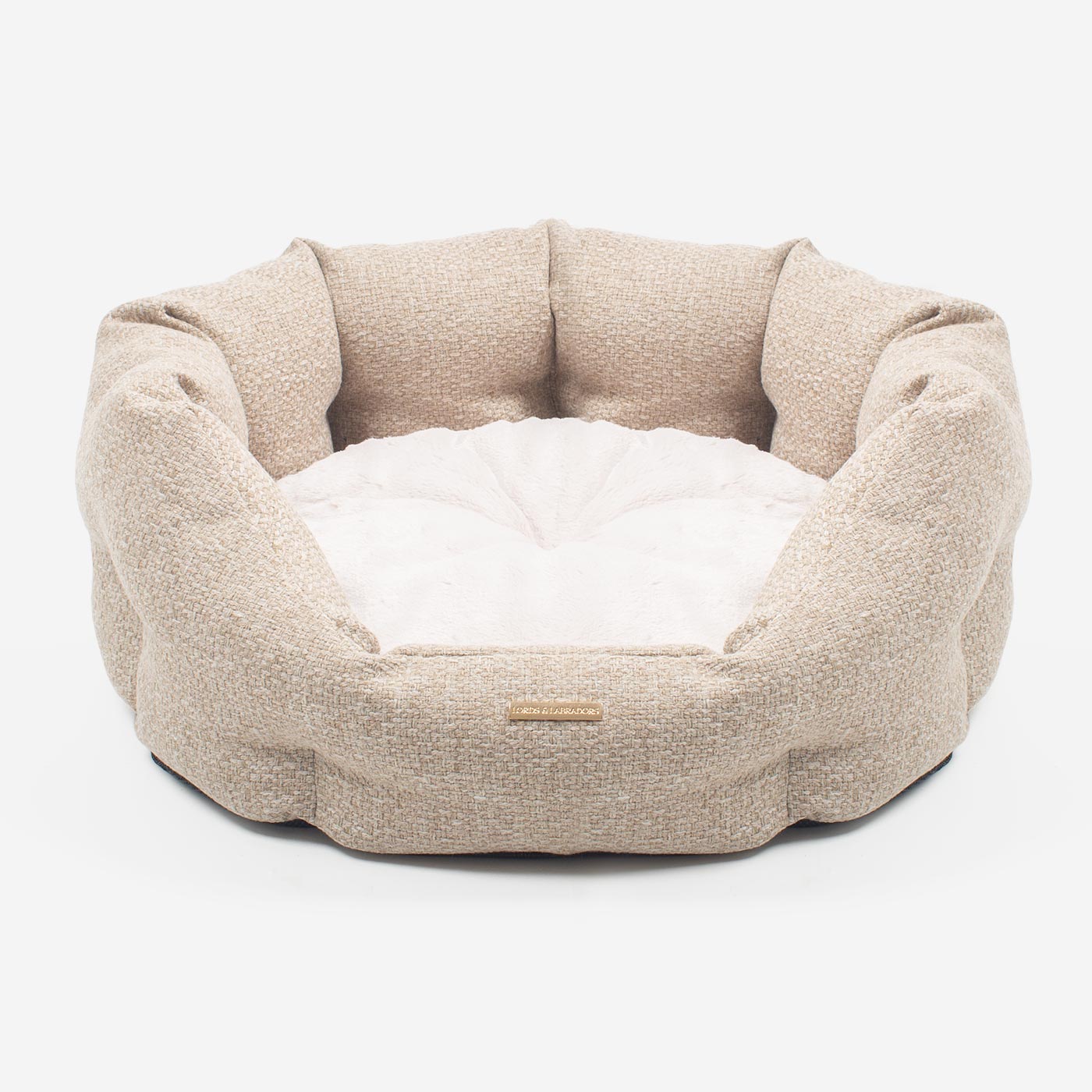 Discover our luxury Herdwick oval dog bed in beautiful sandstone, the ideal choice for dogs to enjoy blissful nap-time, featuring reversible inner cushion with raised sides for dogs who love to rest their head for the ultimate cosiness! Handcrafted in Italy for pure pet luxury! Available now at Lords & Labradors US