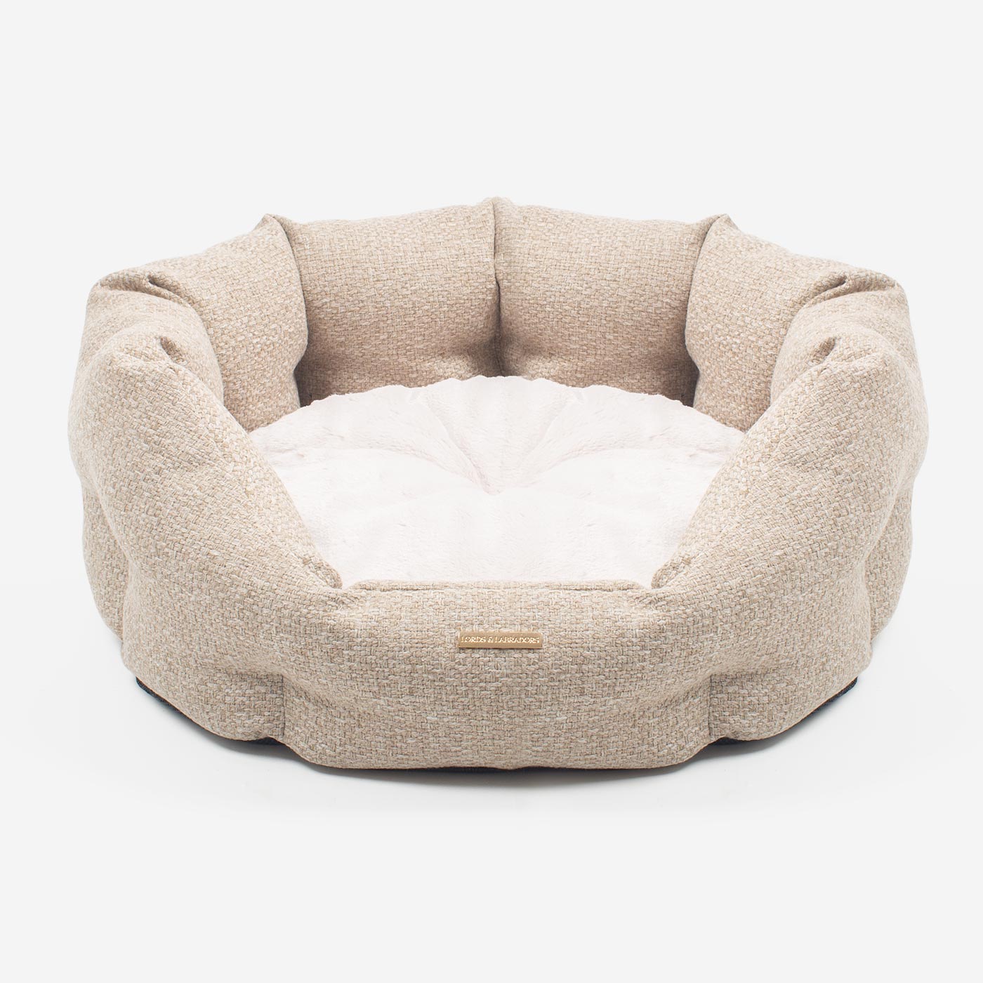 Discover our luxury Herdwick oval dog bed in beautiful sandstone, the ideal choice for dogs to enjoy blissful nap-time, featuring reversible inner cushion with raised sides for dogs who love to rest their head for the ultimate cosiness! Handcrafted in Italy for pure pet luxury! Available now at Lords & Labradors US