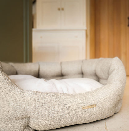 Discover our luxury Herdwick oval dog bed in beautiful sandstone, the ideal choice for dogs to enjoy blissful nap-time, featuring reversible inner cushion with raised sides for dogs who love to rest their head for the ultimate cosiness! Handcrafted in Italy for pure pet luxury! Available now at Lords & Labradors US