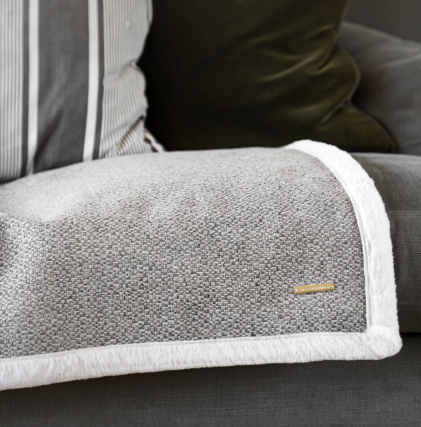 Present your furry friend with our luxuriously thick, plush blanket for your pet. Featuring a reverse side with hardwearing woven fabric handmade in Italy for the perfect high-quality pet blanket! Essentials Herdwick Blanket In Pebble, Available now at Lords & Labradors US