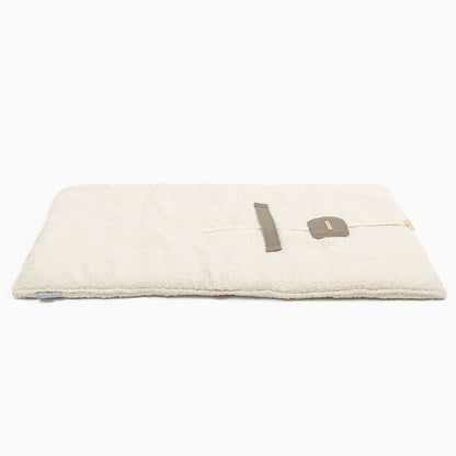 Embark on the perfect pet travel with our luxury Travel Mat in Ivory Boucle. Featuring a Carry handle for on the move once Rolled up for easy storage, can be used as a seat cover, boot mat or travel bed! Available now at Lords & Labradors US