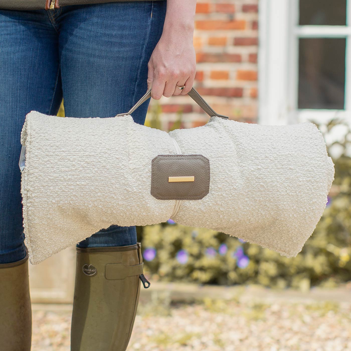 Embark on the perfect pet travel with our luxury Travel Mat in Ivory Boucle. Featuring a Carry handle for on the move once Rolled up for easy storage, can be used as a seat cover, boot mat or travel bed! Available now at Lords & Labradors US