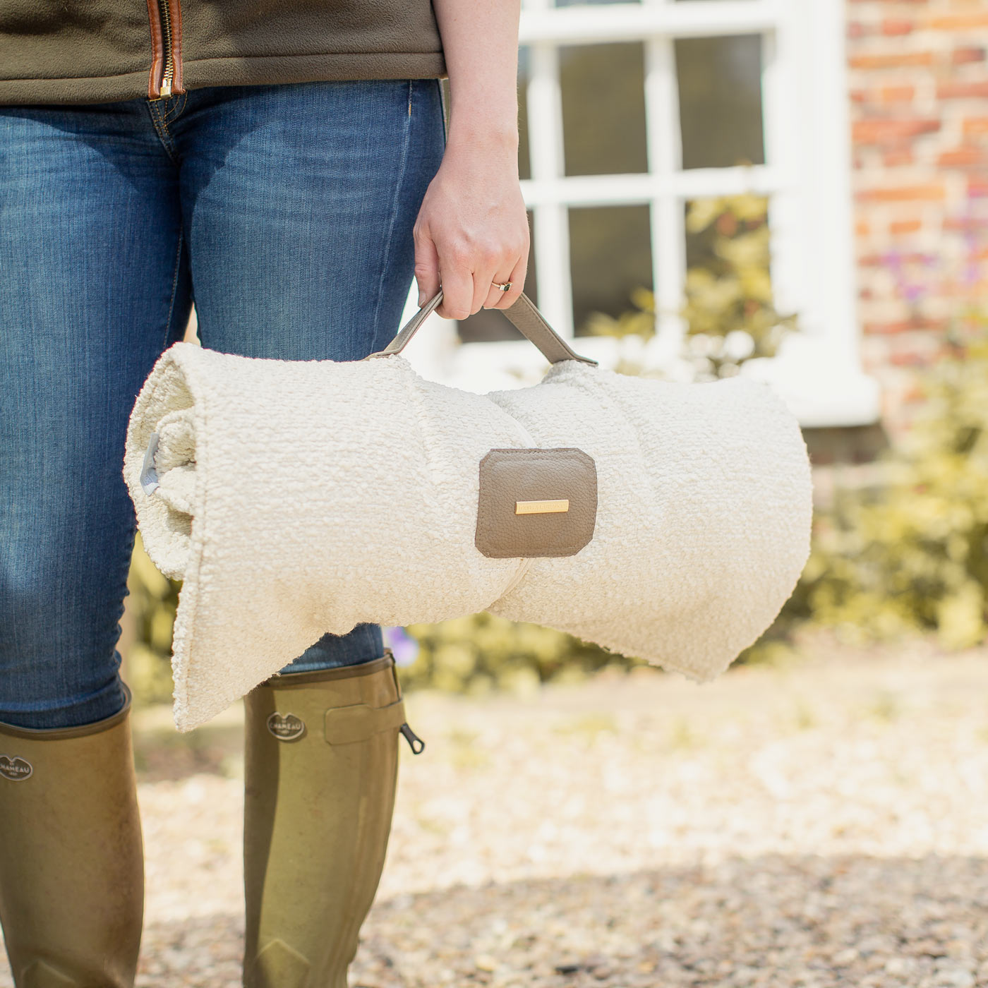 Embark on the perfect pet travel with our luxury Travel Mat in Ivory Boucle. Featuring a Carry handle for on the move once Rolled up for easy storage, can be used as a seat cover, boot mat or travel bed! Available now at Lords & Labradors US