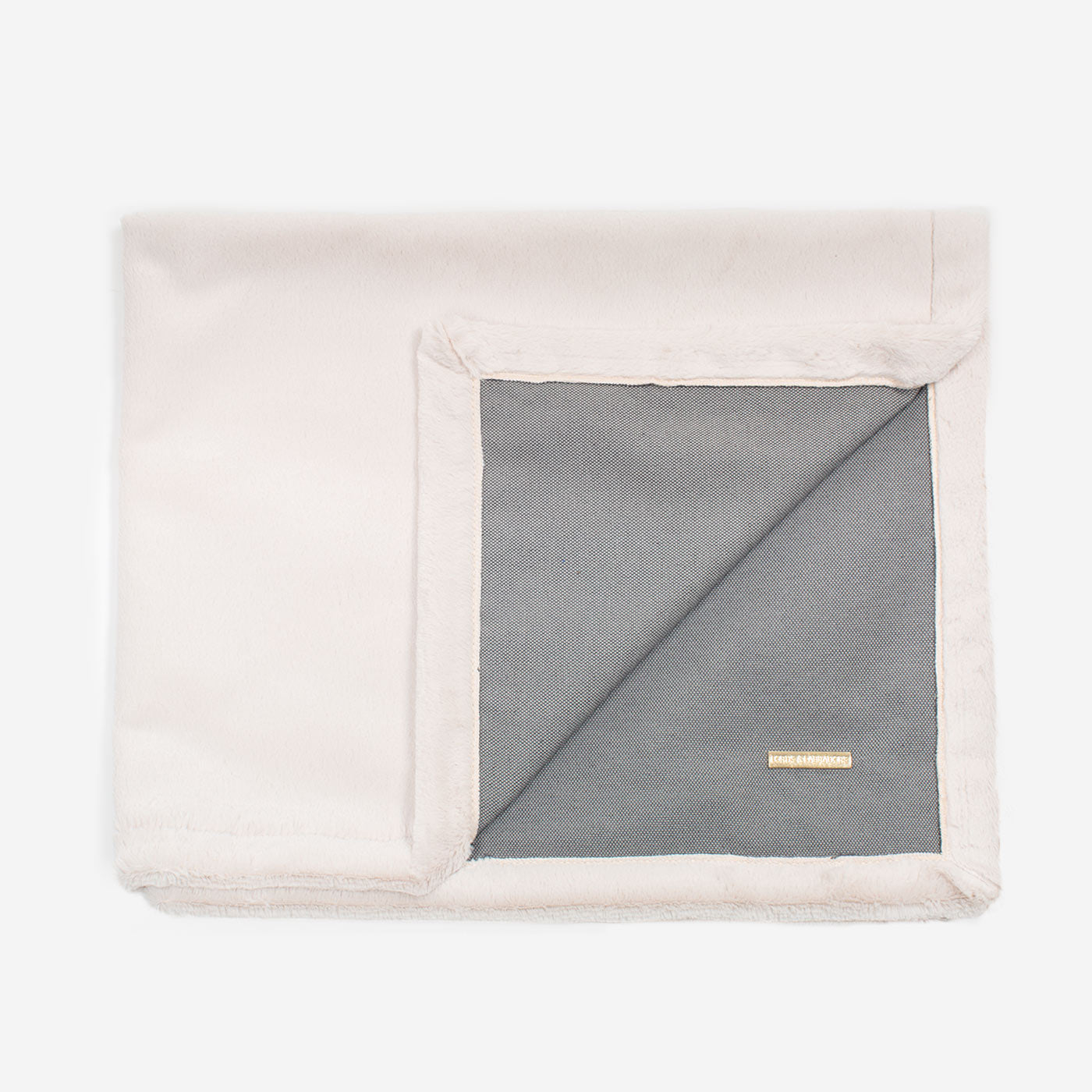 Present your furry friend with our luxuriously thick, plush blanket for your pet. Featuring a reverse side with hardwearing woven fabric handmade in Italy for the perfect high-quality pet blanket! Essentials Twill Blanket In Slate, Available now at Lords & Labradors US