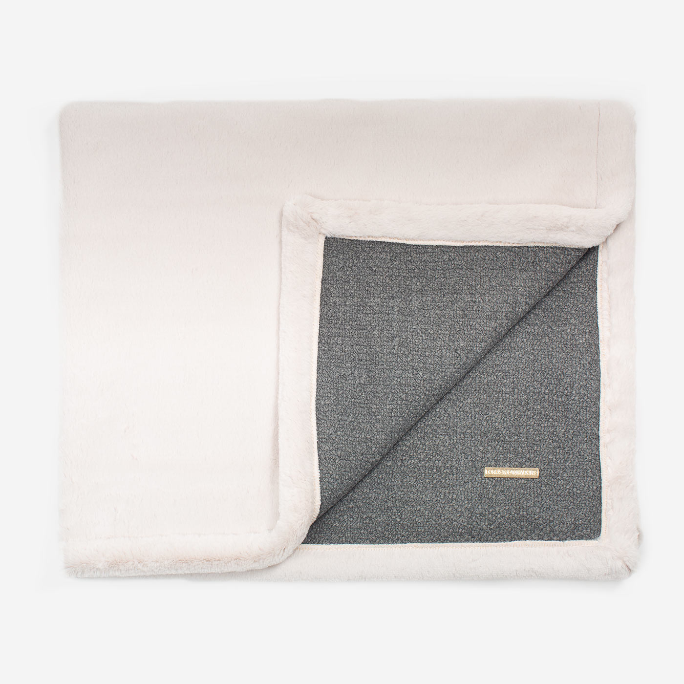 Present your furry friend with our luxuriously thick, plush blanket for your pet. Featuring a reverse side with hardwearing woven fabric handmade in Italy for the perfect high-quality pet blanket! Essentials Herdwick Blanket In Graphite, Available now at Lords & Labradors US