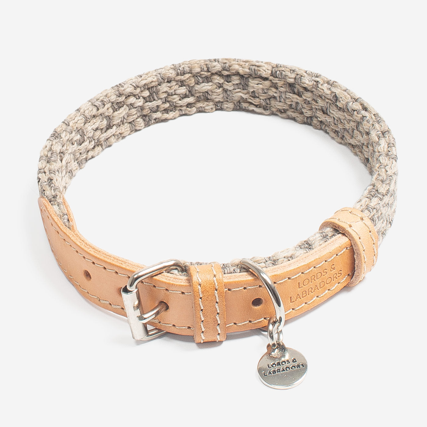 Discover dog walking luxury with our handcrafted Italian dog collar in beautiful pebble with woven grey fabric! The perfect collar for dogs available now at Lords & Labradors US