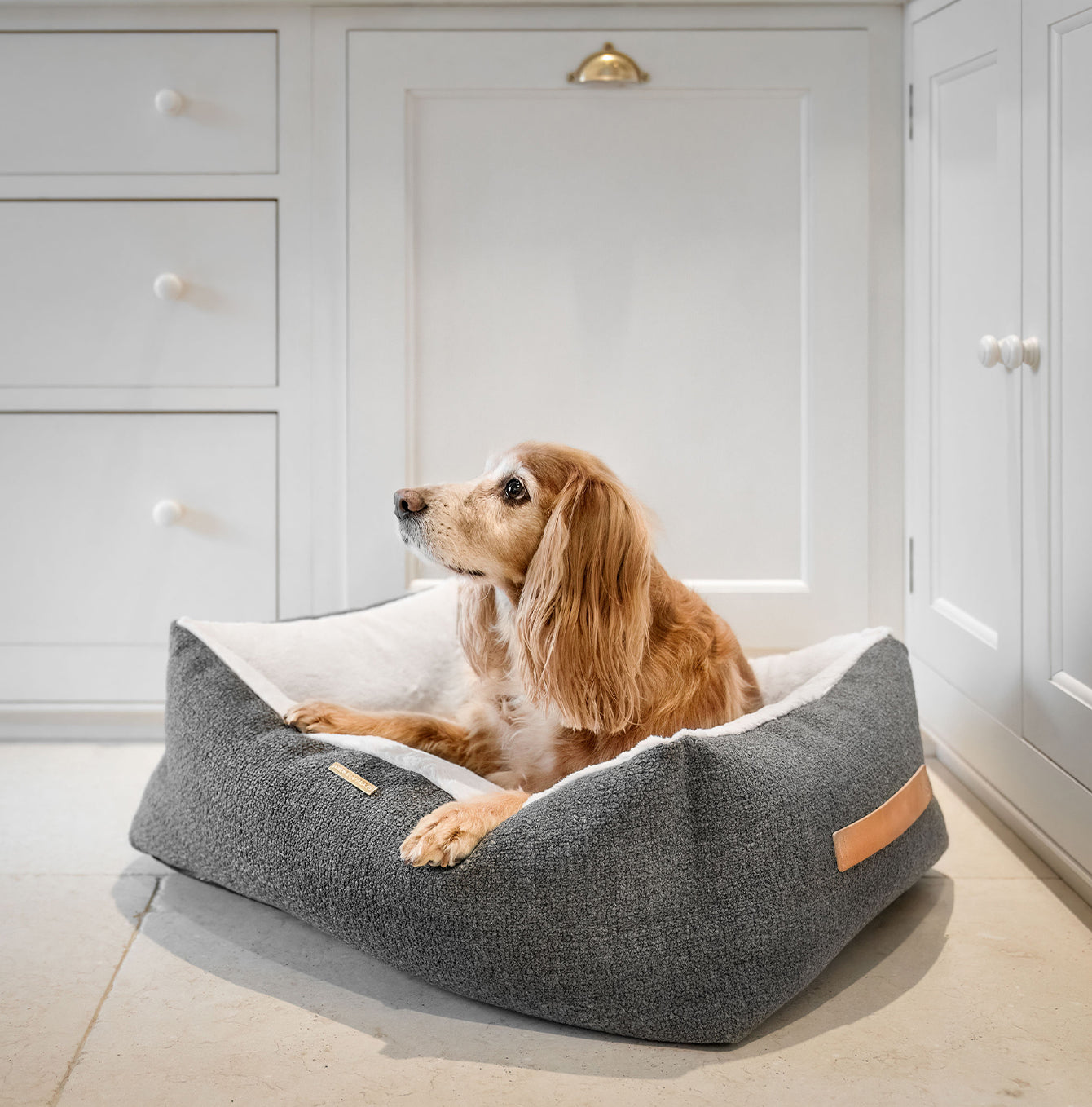 Present your furry friend with our luxuriously thick, plush Essentials Herdwick Box Bed in Graphite. Featuring a reversible inner cushion, along with Convenient carry handles on either side. This is a hardwearing woven fabric handmade in Italy for the perfect high-quality. now available at Lords and Labradors US 